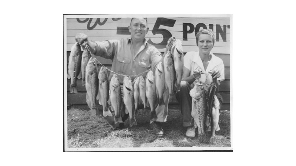 The folks with fish at the Five Points Sign