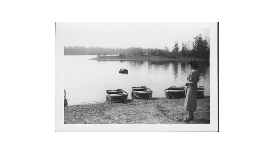 Ginny looking at the lake & boats